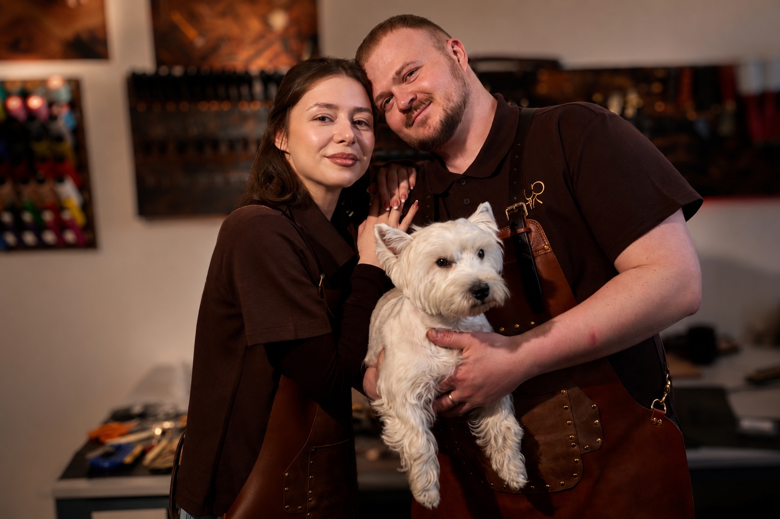 The Zmushko team in their Warsaw atelier with their dog Emma